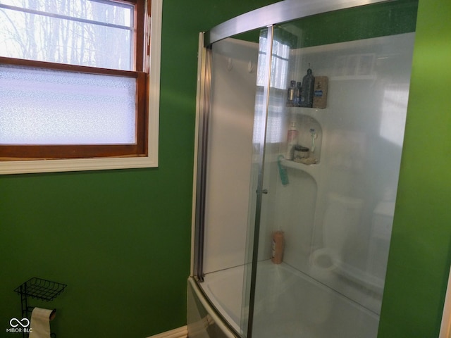 bathroom featuring shower / bath combination with glass door