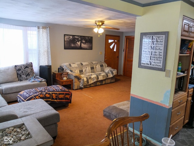 living room featuring dark carpet and ceiling fan