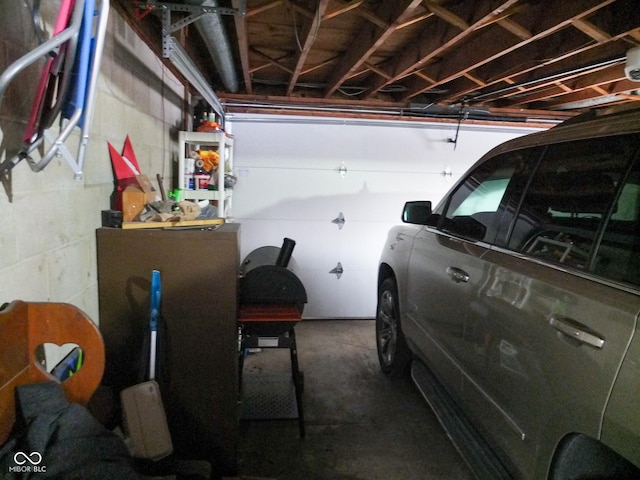 garage with concrete block wall