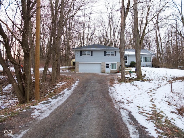 view of front of property with a garage and driveway