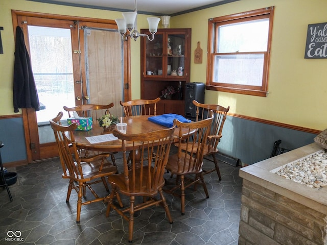 dining room with a notable chandelier and a wealth of natural light