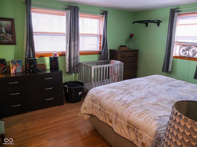 bedroom with wood finished floors