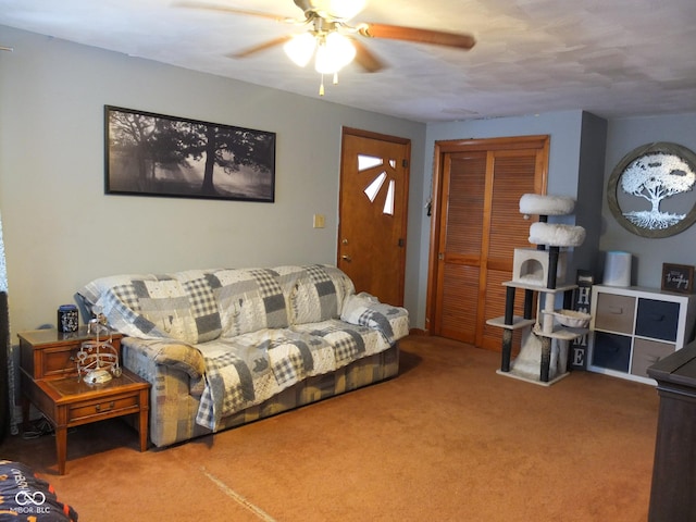 living room with ceiling fan and carpet flooring