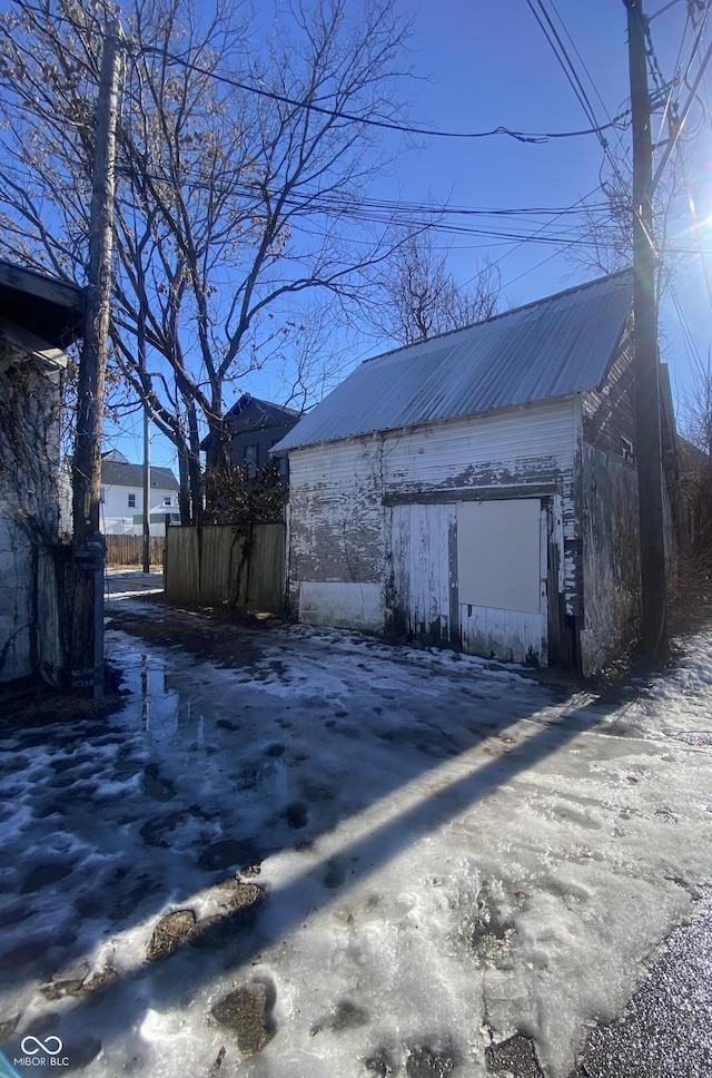 view of property exterior featuring an outbuilding