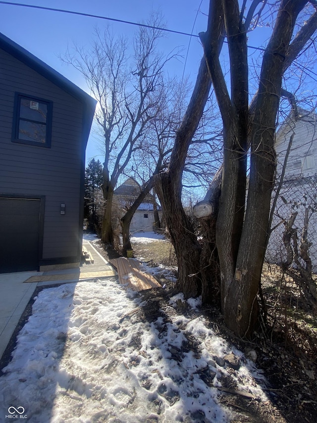 view of yard covered in snow