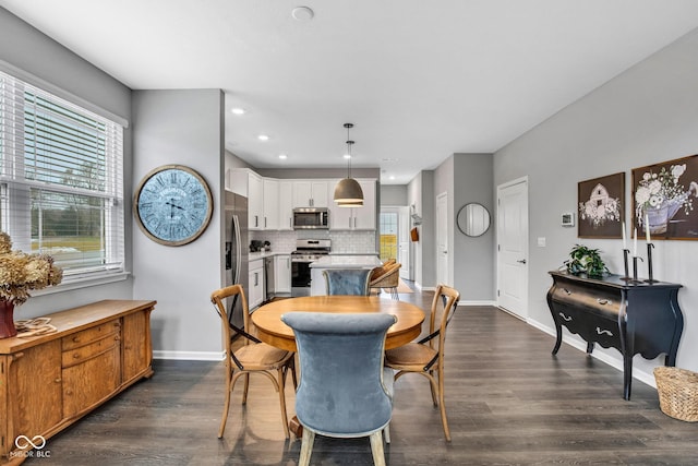 dining room with dark hardwood / wood-style floors