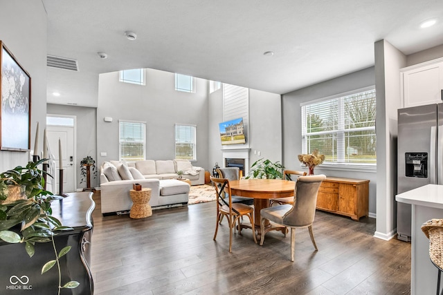 dining area with dark wood-type flooring