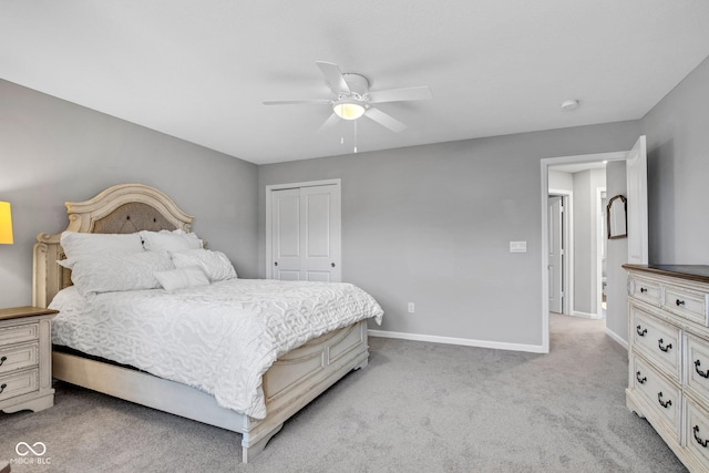 carpeted bedroom featuring ceiling fan and a closet