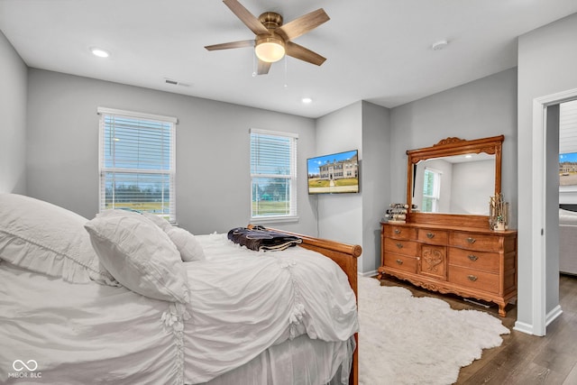 bedroom with dark wood-type flooring and ceiling fan