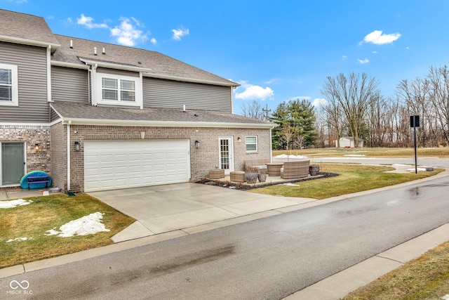 view of front of property featuring a garage and a front yard