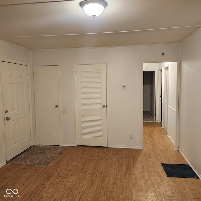 unfurnished bedroom featuring light wood-type flooring