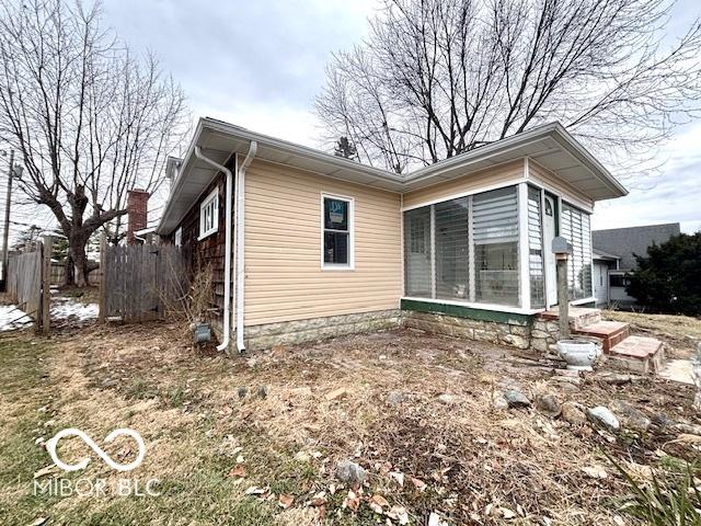 view of side of property with a sunroom