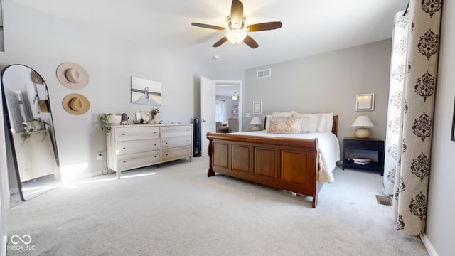 bedroom featuring ceiling fan and light colored carpet