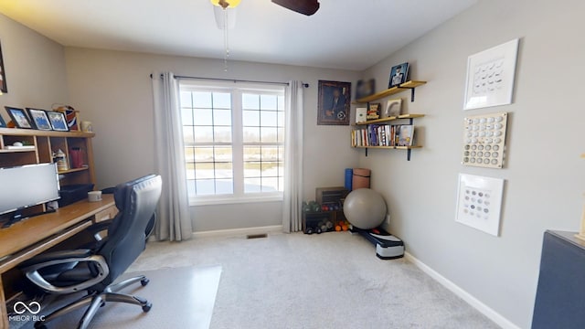 carpeted office featuring plenty of natural light and ceiling fan