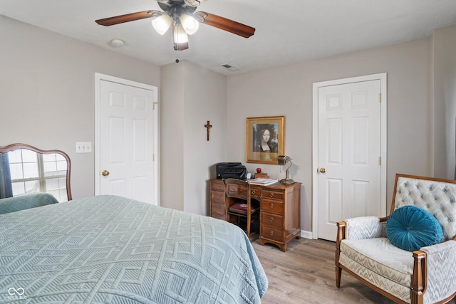 bedroom featuring light hardwood / wood-style floors and ceiling fan