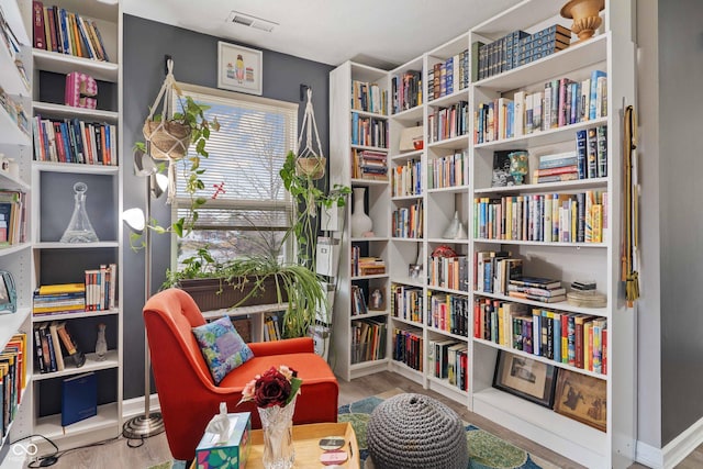 sitting room with light wood-type flooring