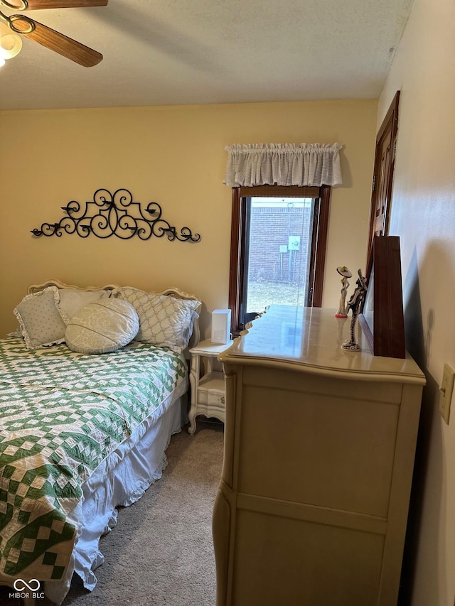 bedroom with ceiling fan and carpet