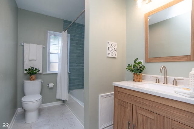 full bathroom with vanity, shower / tub combo, and toilet