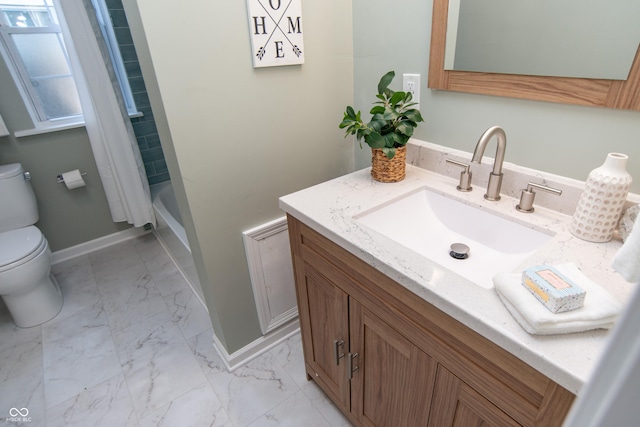 bathroom with vanity, toilet, and a shower with shower curtain