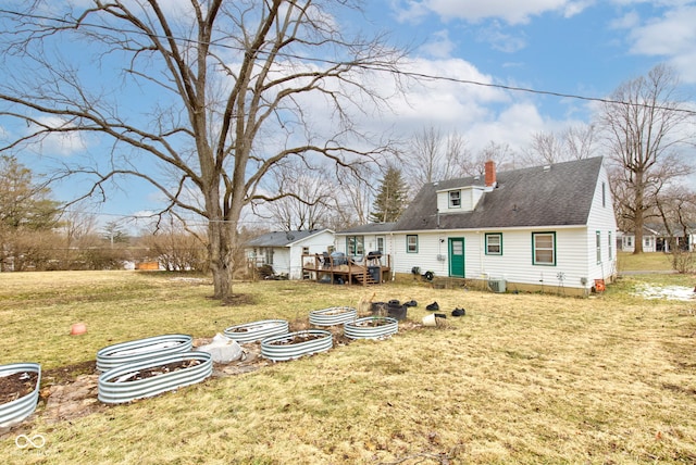 exterior space with a wooden deck and a lawn