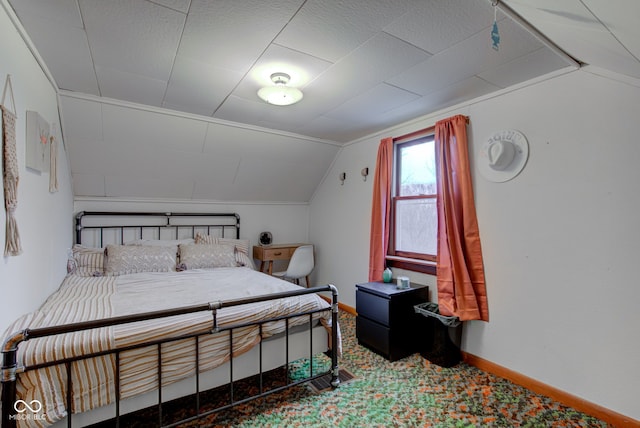 carpeted bedroom featuring vaulted ceiling