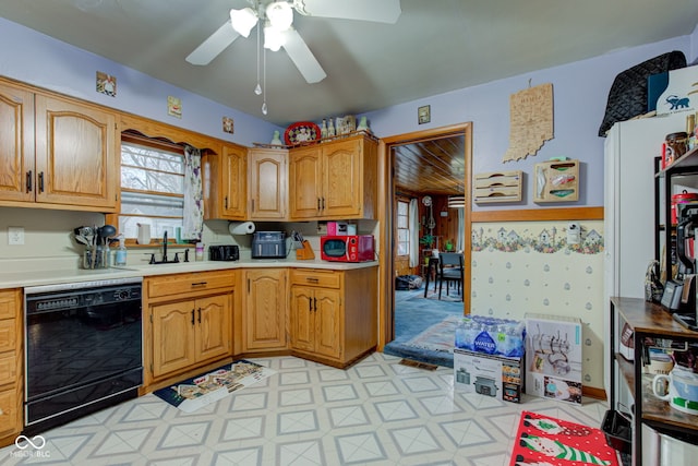 kitchen featuring ceiling fan, dishwasher, and sink