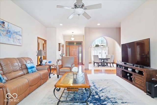 living room with recessed lighting and a ceiling fan