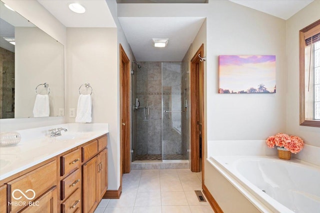 full bathroom with double vanity, a wealth of natural light, a bath, and a shower stall