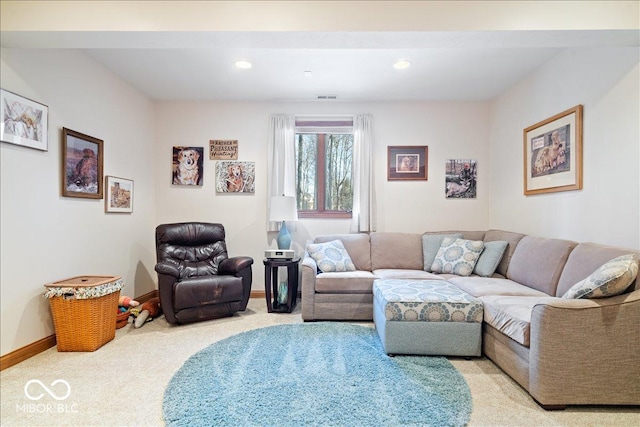 living room featuring recessed lighting, baseboards, visible vents, and light carpet