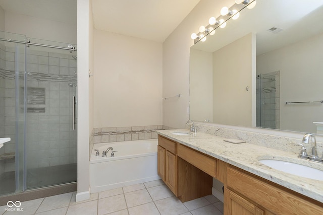 bathroom with shower with separate bathtub, tile patterned floors, and vanity