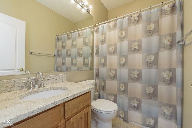 bathroom featuring vanity, tile patterned flooring, curtained shower, and toilet