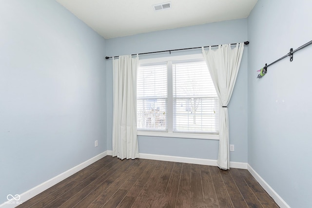 unfurnished room with dark hardwood / wood-style floors