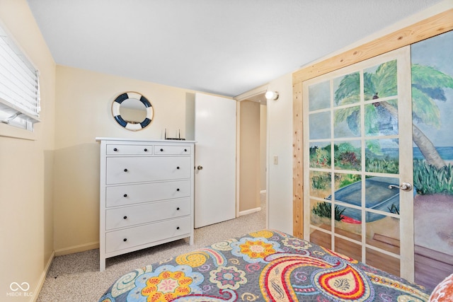 bedroom featuring light colored carpet