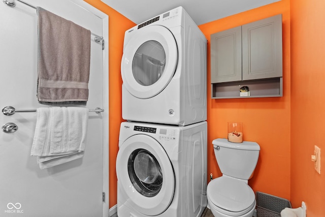 washroom with stacked washer and dryer