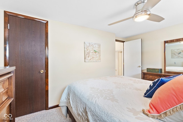 bedroom featuring light colored carpet and ceiling fan