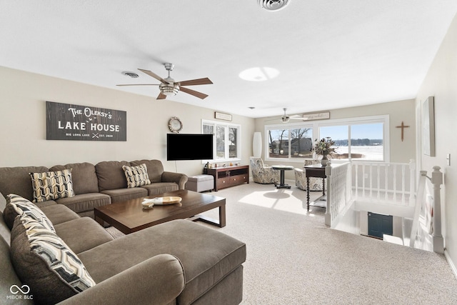 carpeted living room featuring ceiling fan