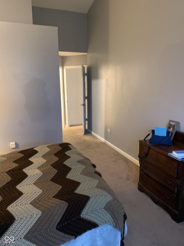 bedroom featuring light carpet