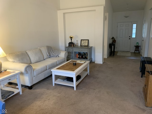 living room featuring light carpet