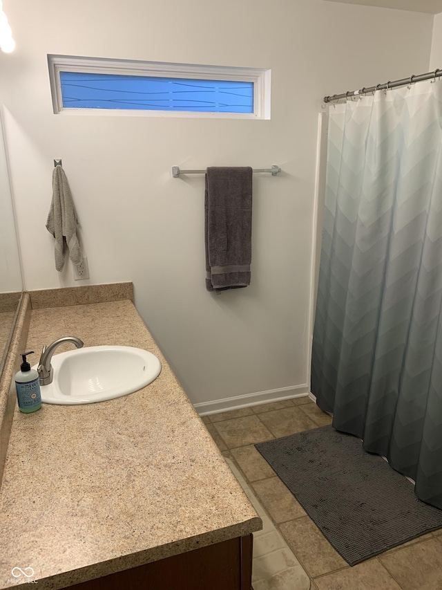 bathroom with vanity and tile patterned floors