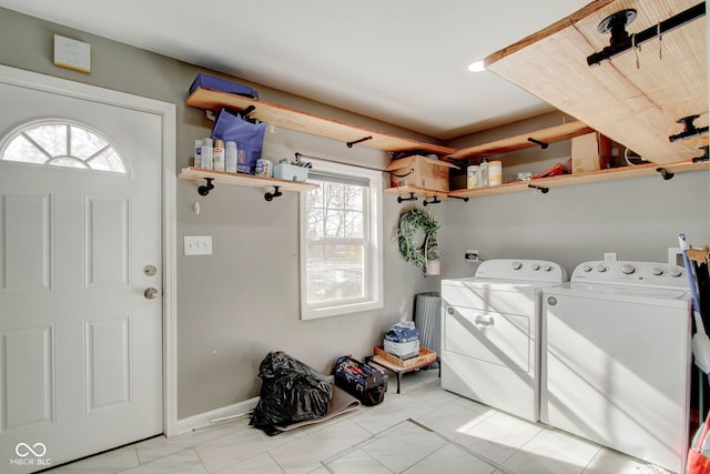 clothes washing area with independent washer and dryer