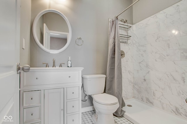 bathroom with vanity, a shower with shower curtain, and toilet