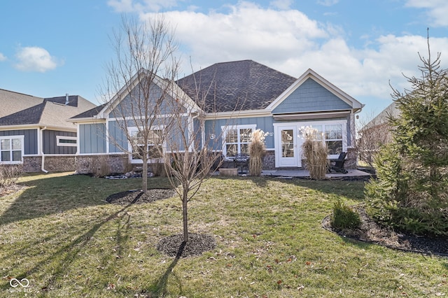 back of property featuring a patio and a lawn