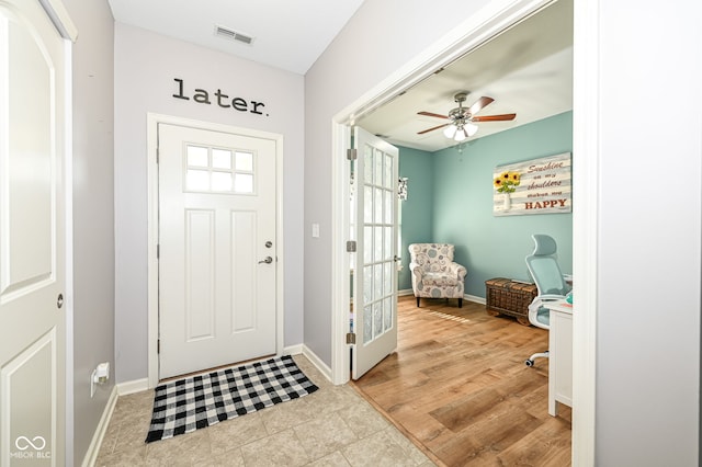 entryway with light hardwood / wood-style flooring and ceiling fan