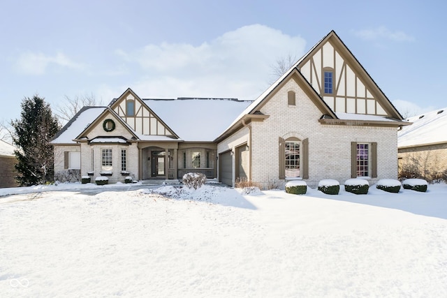 tudor home featuring a garage