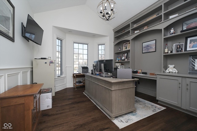 office area with lofted ceiling, dark hardwood / wood-style floors, a chandelier, and built in shelves