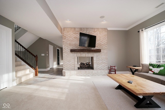 living room featuring ornamental molding, a fireplace, and carpet