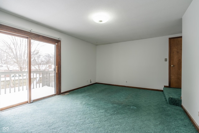 unfurnished room featuring carpet flooring