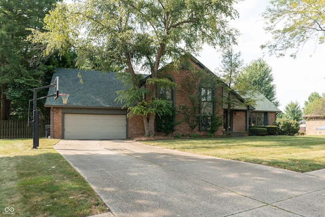 view of front facade with a garage and a front lawn