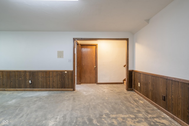 empty room with wooden walls