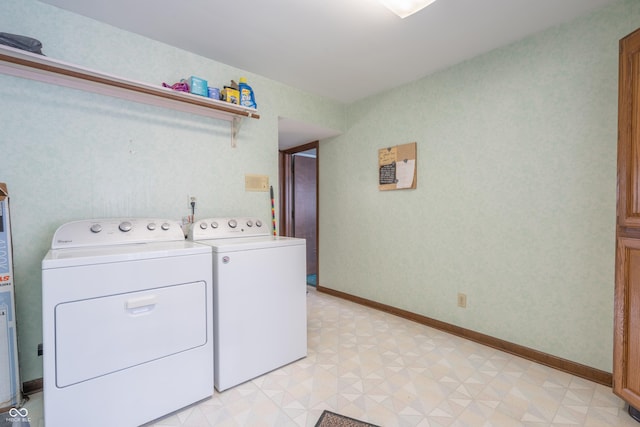 clothes washing area featuring separate washer and dryer